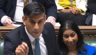 A video grab from footage broadcast by the UK Parliament's Parliamentary Recording Unit (PRU) shows Britain's Home Secretary Suella Braverman (right) listening as Britain's Prime Minister Rishi Sunak speaks during the weekly session of Prime Minister's Questions (PMQs) in the House of Commons in London on March 8, 2023. (Photo by Handout / PRU / AFP) 