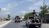 In this file photo taken on March 07, 2023 National Guard and military vehicles take part in an operation to transfer two of the four US citizens kidnapped in Mexico's crime-ridden northeast, back to Brownsville in the US, after the other two were found dead, in Matamoros, Tamaulipas State, Mexico.  (Photo by AFP)