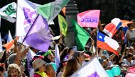 Supporters of Chile's President Gabriel Boric take part in an event to celebrate his first year in office, outside the La Moneda presidential palace in Santiago, on March 11, 2023.  (Photo by MARTIN BERNETTI / AFP)