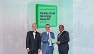 QIB’s Chief Strategy and Digital Officer, Constantinos Constantinides receives the awards.