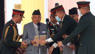 Nepal's newly elected President Ram Chandra Poudel (second left) takes oath of office at the presidential house in Kathmandu on March 13, 2023. (Photo by Dipesh Shrestha / AFP)