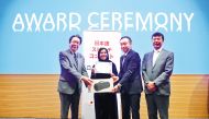Ambassador of Japan to Qatar, H E Satoshi Maeda (left) handing the award certificate to Fatima Al Marzoqi, who topped the 14th Japanese Speech Contest, at Qatar University. 