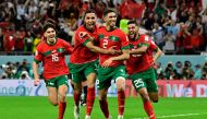 Morocco's defender Achraf Hakimi (centre) celebrates with teammates after converting the last penalty during the penalty shoot-out to win the Qatar 2022 World Cup round of 16 match between against Spain at the Education City Stadium in Al-Rayyan, west of Doha, on December 6, 2022. File photo / AFP