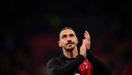 AC Milan's Swedish forward Zlatan Ibrahimovic claps as he warms up prior to the Italian Serie A football match between AC Milan and US Salernitana 1919 at the San Siro stadium in Milan on March 13, 2023. (Photo by Marco BERTORELLO / AFP)