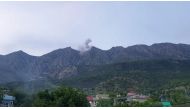 Smoke billows following reported Turkish warplane raids, from a site in the Matin Mountains near the village of Koherzi in the Amadiyah district, northeast of Dohuk in the Kurdish autonomous region of Iraq, on April 28th 2022. The Thursday helicopter crash also took place in the Dohuk province. (AFP)