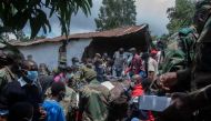Malawi Defence Force, (MDF) soldiers recover a body of a victim of landslide which resulted due to heavy rains resulting from cyclone freddy during an MDF rescue operation at Manje informal settlement in Blantyre, southern Malawi, March 16, 2023. (Photo by Amos Gumulira / AFP)