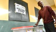 A voters casts his ballot at polling station for a gubernatorial and House of Assembly candidates during local elections, in Lagos, on March 18, 2023. (Photo by PIUS UTOMI EKPEI / AFP)