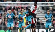Southampton's English midfielder Ainsley Maitland-Niles (centre) is tackled and is awarded a penalty during the English Premier League football match between Southampton and Tottenham Hotspur at St Mary's Stadium in Southampton, southern England on March 18, 2023. (Photo by Adrian DENNIS / AFP)