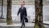 Chairman of the Swiss National Bank (SNB) Thomas Jordan walks on his way to the Swiss Federal Department of Finance for talks on Credit Suisse bank crisis, in Bern on March 19, 2023.  (Photo by Fabrice COFFRINI / AFP)
 