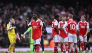 Arsenal's English midfielder Bukayo Saka gestures to fans on the pitch after the English Premier League football match between Arsenal and Crystal Palace at the Emirates Stadium in London on March 19, 2023. - Arsenal won the game 4-1. (Photo by JUSTIN TALLIS / AFP)
