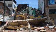 Destroyed buildings are seen after an earthquake in the city of Machala, Ecuador on March 18, 2023.  (Photo by Gleen Suarez / AFP)