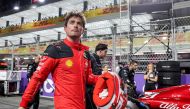 Ferrari's Monegasque driver Charles Leclerc walks along the pit lane ahead of the Saudi Arabia Formula One Grand Prix at the Jeddah Corniche Circuit in Jeddah on March 19, 2023. (Photo by Giuseppe Cacace / AFP)