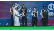 India's Pankaj Advani receives the winner's trophy during the presentation ceremony.