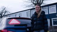 Picture taken on February 10, 2023 shows Evelina Christiansen, 15, posing next to a car in Huddinge, Sweden. Photo by Alma COHEN / AFP