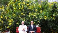 This handout photograph taken on March 20, 2023 and released by the Indian Press Information Bureau (PIB) shows Japan's Prime Minister Fumio Kishida and his Indian counterpart Narendra Modi during their visit at Buddha Jayanti Park in New Delhi. (Photo by PIB / AFP) 