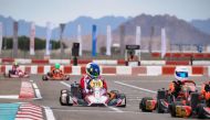  Qatar Motorsport Academy's Taha Hassiba (centre) drives during the UAE Rotax Max Challenge Round 7.2 at Al Ain Raceway.