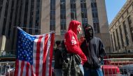 People gather outside of a Manhattan courthouse as the nation waits for the possibility of an indictment against former president Donald Trump by the Manhattan District Attorney Alvin Bragg's office on March 21, 2023 in New York City. Spencer Platt/Getty Images/AFP 