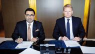 Acting CEO, Chief Treasury and Investment Officer Gudni Stiholt  Adalsteinsson (right) and Divisional Head – Business Development Bank Al Habib Qamber Ali during the agreement signing event. 