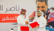 Nasser Al Attiyah and Faisal Mohamed Al Emadi, Acting Secretary-General of QRCS at the agreement signing ceremony.