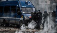  Police officer stand near tear gas during a demonstration, a week after the government pushed a pensions reform through parliament without a vote, using the article 49.3 of the constitution, in Lyon, central France, on March 23, 2023. Photo by JEFF PACHOUD / AFP
