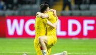 Players from Kasakhstan celebrates after winning the UEFA Euro 2024 Group H qualification football match Kasakhstan v Denmark in Astana, Kazakhstan on March 26, 2023. (Photo by Bo Amstrup / Ritzau Scanpix / AFP) 