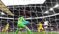 England's striker Harry Kane (R) scores his team's first goal during the UEFA Euro 2024 group C qualification football match between England and Ukraine at Wembley Stadium in London on March 26, 2023. (Photo by Glyn KIRK / AFP)