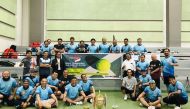 Indonesian Ambassador to Qatar, H E Ridwan Hassan (in white shirt) with players during a tennis tournament for Indonesian workers held recently.