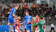 Italy's forward Mateo Retegui (L) scores his team's first goal by a header during the UEFA Euro 2024 Group C qualification match between Malta and Italy, at the National stadium in Ta'Qali, Malta, on March 26, 2023. Photo by Alberto PIZZOLI / AFP