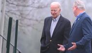 US President Joe Biden (left) speaks with another congregant on the walk back to the motorcade as he departs from Saint Joseph on the Brandywine Roman Catholic Church in Wilmington, Delaware on March 25, 2023. (Photo by Mandel NGAN / AFP)