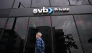 In this file photo taken on March 20, 2023 the SVB Private logo is displayed outside of a Silicon Valley Bank branch in Santa Monica, California.(Photo by Patrick T. Fallon / AFP)