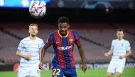 Barcelona's Spanish forward Ansu Fati goes for the ball during the UEFA Champions League group G football match between Barcelona and Dynamo Kiev at the Camp Nou stadium in Barcelona, on November 4, 2020. / AFP / LLUIS GENE

