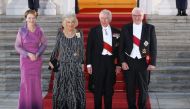 Britain's King Charles III (2nd R)and Britain's Camilla, Queen Consort (2nd L) are welcomed by German President Frank-Walter Steinmeier (R) and his wife Elke Buedenbender as they arrive for a state banquet at the presidential Bellevue Palace in Berlin, on March 29, 2023. (Photo by Ronny Hartmann / AFP)