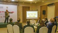 A QRCS official with Gaza graduates during the training session.