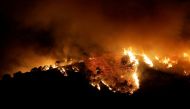 File Photo: A forest fire is seen in Benahavis, Spain, June 8, 2022. (REUTERS/Jon Nazca)