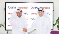 CEO Ooredoo Qatar, Sheikh Ali bin Jabor bin Mohammed Al Thani (right), and CEO of beIN MENA, Mohammad Al Subaie, at the agreement signing ceremony. 