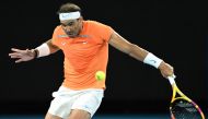 In this file photograph taken on January 18, 2023, Spain's Rafael Nadal hits a return to Mackenzie McDonald of the US during their men's singles match on day three of the Australian Open tennis tournament in Melbourne. Photo by MANAN VATSYAYANA / AFP