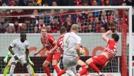 Bayern Munich's Dutch defender Matthijs de Ligt (C) scoring the opening goal during the German first division Bundesliga football match between SC Freiburg and Bayern Munich in Freiburg on April 8, 2023. (Photo by Thomas KIENZLE / AFP) 