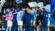 Juventus' Brazilian defender Alex Sandro (Front R) leaves the picth as Lazio's Italian forward Ciro Immobile (Rear C) and teammates celebrate at the end of the Italian Serie A football match between Lazio and Juventus on April 8, 2023 at the Olympic stadium in Rome. (Photo by Tiziana FABI / AFP)