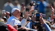 Pope Francis waves from the Popemobile car as he makes a tour of St. Peter's square following the Easter Sunday mass on April 9, 2023 in The Vatican. (Photo by Andreas Solaro / AFP)