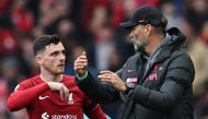 Liverpool's German manager Jurgen Klopp (R) gives instructions to Liverpool's Scottish defender Andrew Robertson during the English Premier League football match between Liverpool and Arsenal at Anfield in Liverpool, north west England on April 9, 2023. (Photo by Paul ELLIS / AFP)