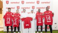 Ooredoo Qatar’s CEO Sheikh Ali bin Jabor Al Thani (left), and Vice-President of Al Duhail Sports Club Khalifa Al Sulaiti with Al Duhail players during the signing of the agreement.