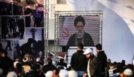 Iran's President Ebrahim Raisi delivers a televised speech during a rally marking Al-Quds (Jerusalem) Day, a commemoration in support of the Palestinian people celebrated annually on the last Friday of the Muslim fasting month of Ramadan, in Gaza City, on April 14, 2023. (Photo by MOHAMMED ABED / AFP)