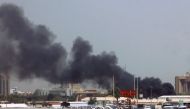 Heavy smoke bellows above buildings in the vicinity of the Khartoum airport on April 15, 2023, amid clashes in the Sudanese capital. Photo by AFP
