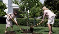US First Lady Jill Biden and Yuko Kishida, spouse of Japanese Prime Minister Fumio Kishida, participate in a tree planting ceremony on the South Lawn of the White House in Washington, DC, on April 17, 2023. (Photo by Brendan Smialowski / AFP)