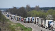 Truck drivers queue on over ten kilometers at the Rava-Ruska border checkpoint on the Ukrainian-Polish border, on April 18, 2023. Photo by YURIY DYACHYSHYN / AFP