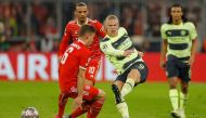 Manchester City's Norwegian striker Erling Haaland gets a shot away past Bayern Munich's German midfielder Joshua Kimmich during the UEFA Champions League quarter-final, second leg football match between Bayern Munich and Manchester City in Munich, southern Germany on April 19, 2023. (Photo by Odd ANDERSEN / AFP)