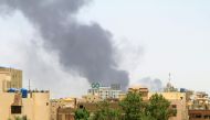 A general view shows smoke billowing in Khartoum on April 20, 2023, as fighting between the army and paramilitary forces led by rival generals rages on. (Photo by AFP)