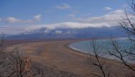 This photograph taken on March 17, 2023, shows a general view of the Prespa lake near Otesevo, in North Macedonia. (Photo by Armend NIMANI / AFP)