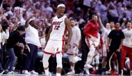 Retransmission with alternate crop.) Jimmy Butler #22 of the Miami Heat reacts during the fourth quarter against the Milwaukee Bucks in Game Four of the Eastern Conference First Round Playoffs at Kaseya Center on April 24, 2023 in Miami, Florida.  Megan Briggs/AFP