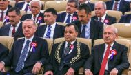 This handout picture released by the Republican People's Party press office on April 25, 2023 shows Turkish President Recep Tayyip Erdogan (left) and the leader of the Republican People's Party (CHP) and presidential candidate Kemal Kilicdaroglu (right) attending a ceremony marking the 61st anniversary of the Constitutional Court of the Republic of Turkey, in Ankara, on April 25, 2023. (Photo by Republican People's Party press office / AFP) 